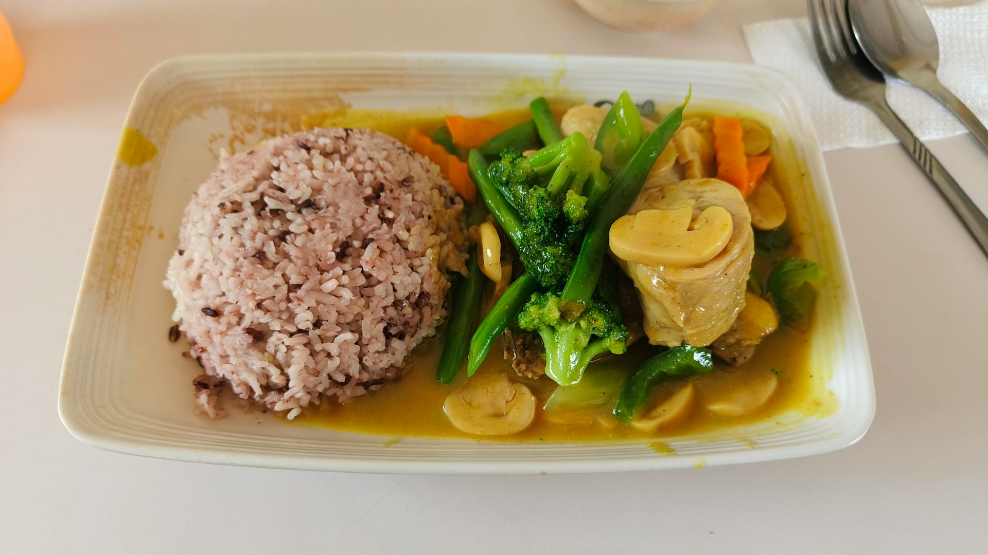 a white plate topped with meat and veggies